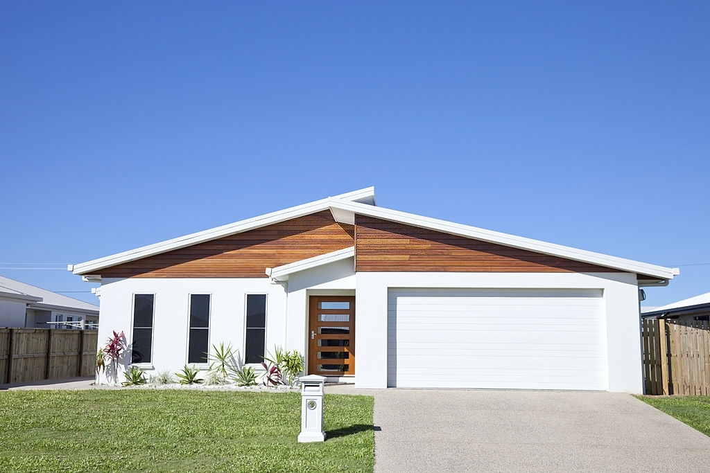 white low set single story family home